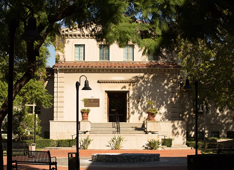 exterior of south entrance to Harper Hall with shade from trees cast over