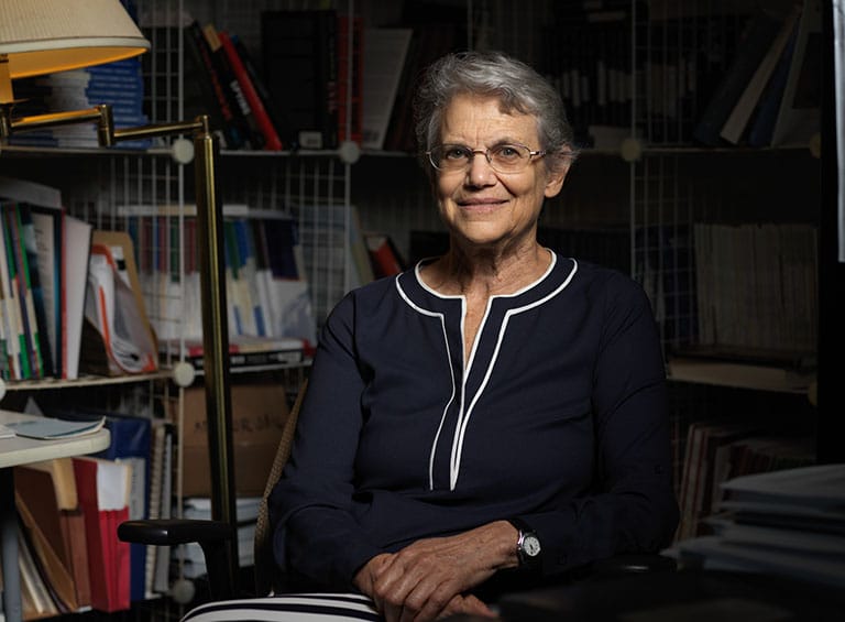 alumna Jean Maria Arigo sitting in an office