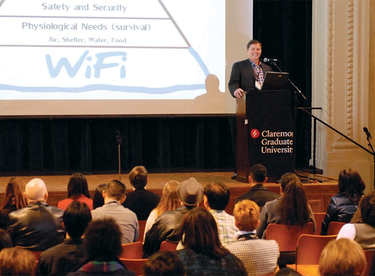 Stewart Donaldson speaking at podium at conference