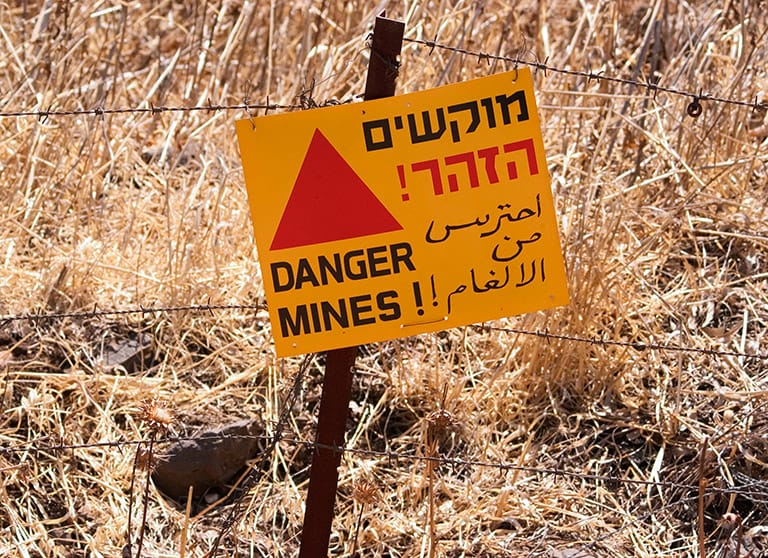 A sign warns of a leftover minefield in the Golan Heights, Israel