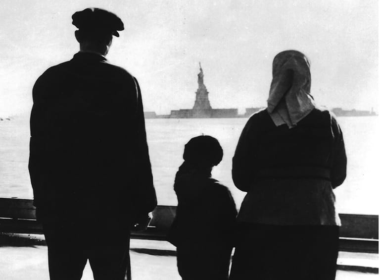 Immigrants looking at the Statue of Liberty