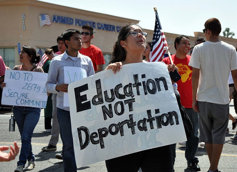 Photo of protesters at a rally on immigration