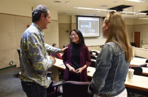 Photo of Shaun Tomson and Jeanne Nakamura addressing an audience member