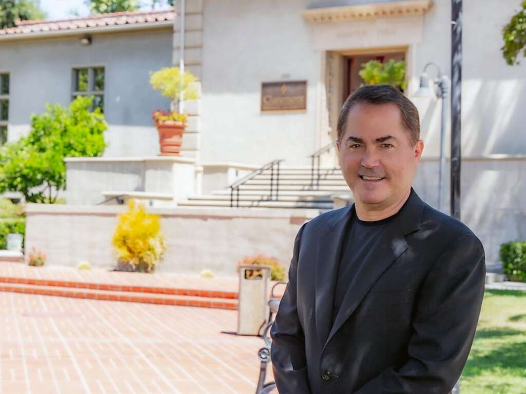 President Len Jessup outside Harper Hall