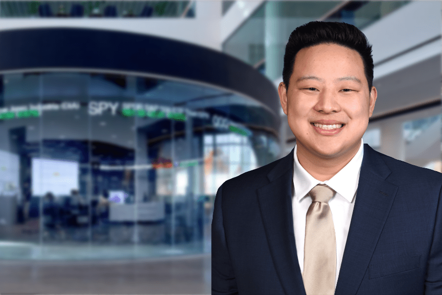 Matthew Ng in front of the New York Stock Exchange