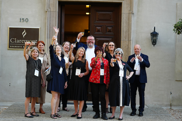 CGU deans and directors raising a toast at the Centennial Dinner, 2025.