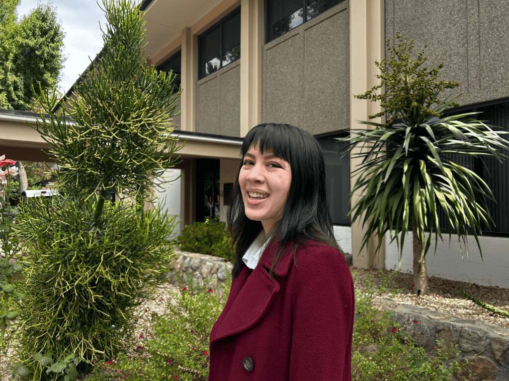 audrey smith standing and smiling at CGU