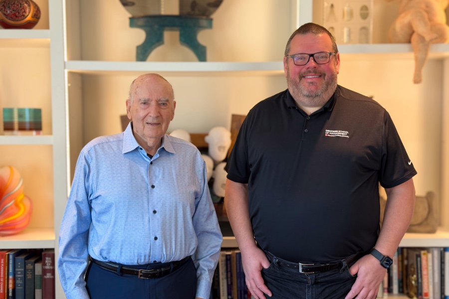 Dean Dave Sprott standing next to Philip Kotler