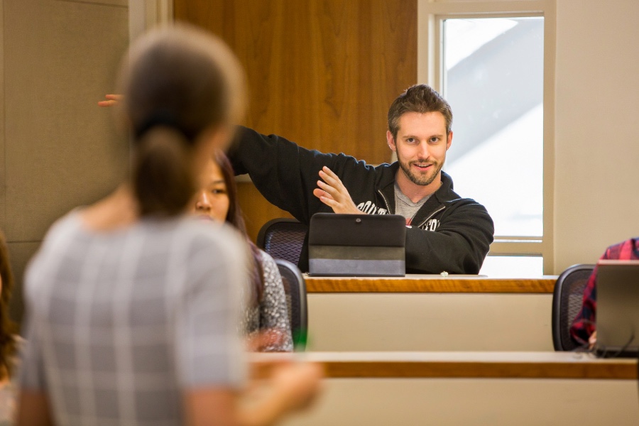 Drucker student in classroom engaging faculty