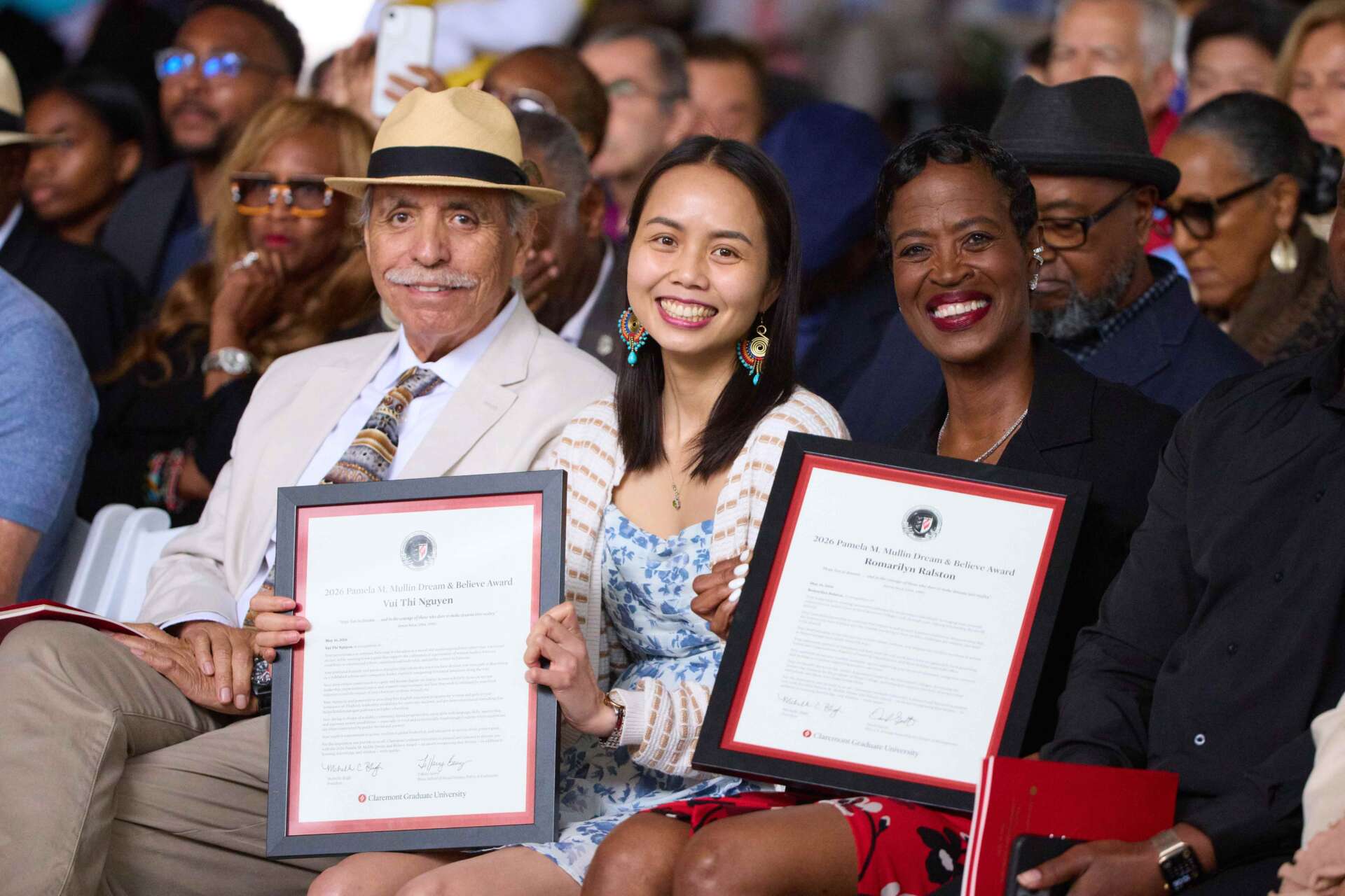 thi vui nguyen and romarilyn ralston holding up their dream and believe awards